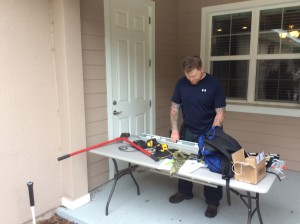 Sgt. Tovet assists in modifying the blinds to receive the 12 volt tilt motors.